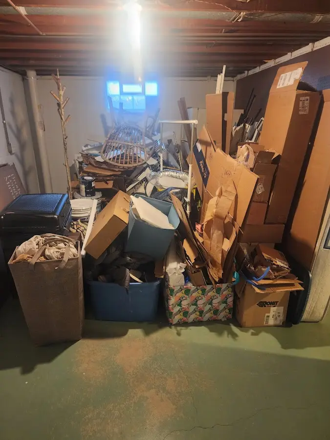 Roll-off dumpster container at job site for 2 Yard Dumpster Rental in Cross Mountain