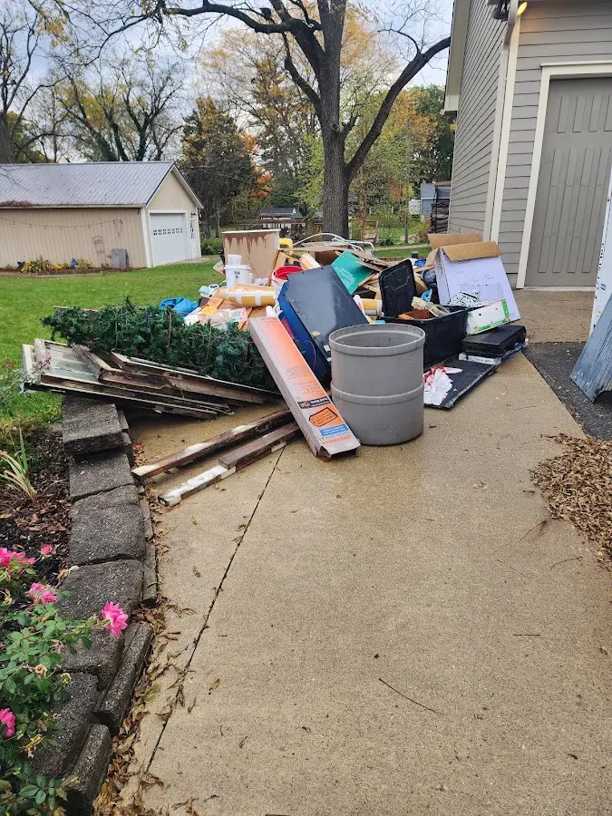 Dumpster being loaded with debris for 30 Yard Dumpster Rental in Cross Mountain